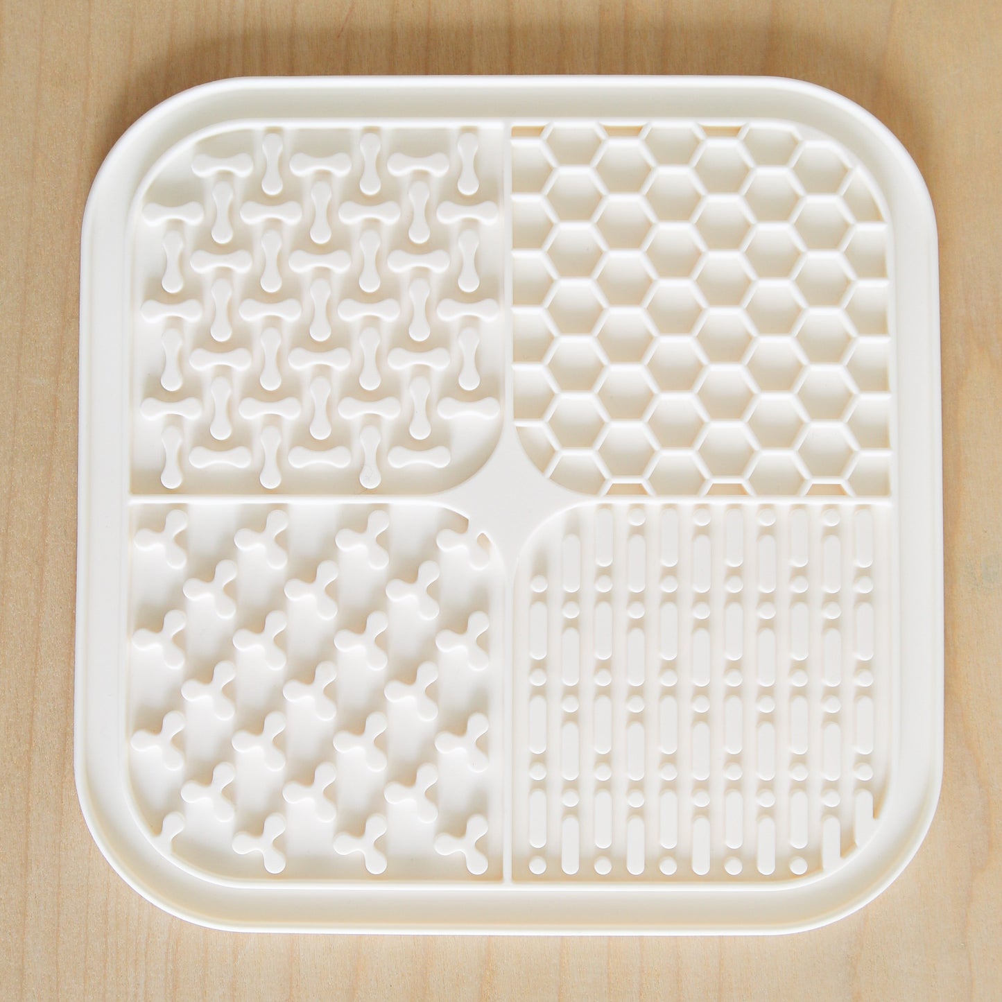 Easy to clean dog lick mat shown in sink