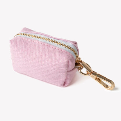 pink dog poop bag pouch with gold hardware

