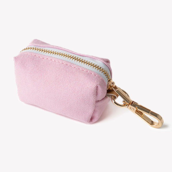 pink dog poop bag pouch with gold hardware

