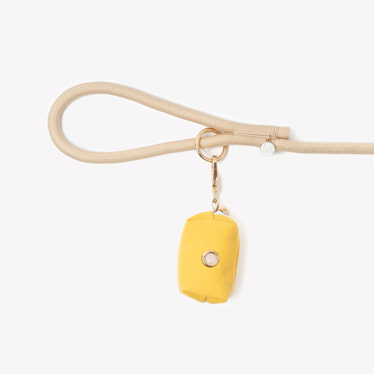 yellow dog poop bag holder with gold clip

