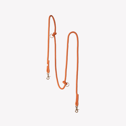 FURLOU hands free braided dog leash in terracotta on a white background