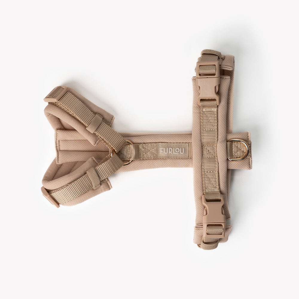 Side view of padded adjustable tan dog harness

