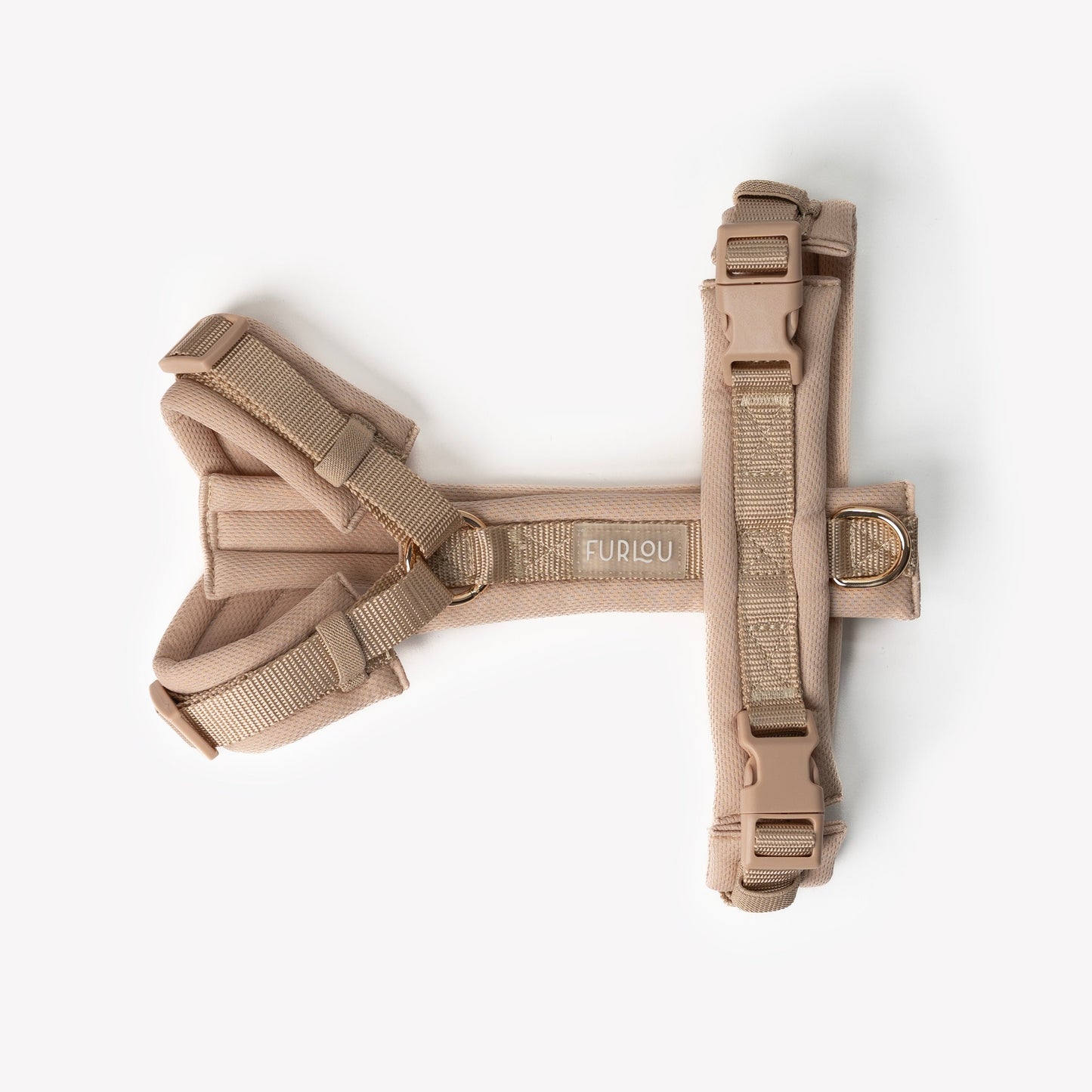 Side view of padded adjustable tan dog harness

