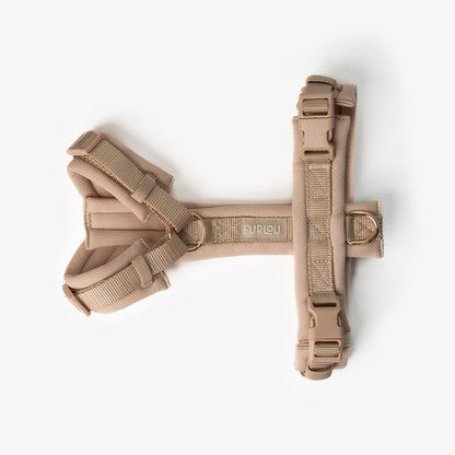Side view of padded adjustable tan dog harness

