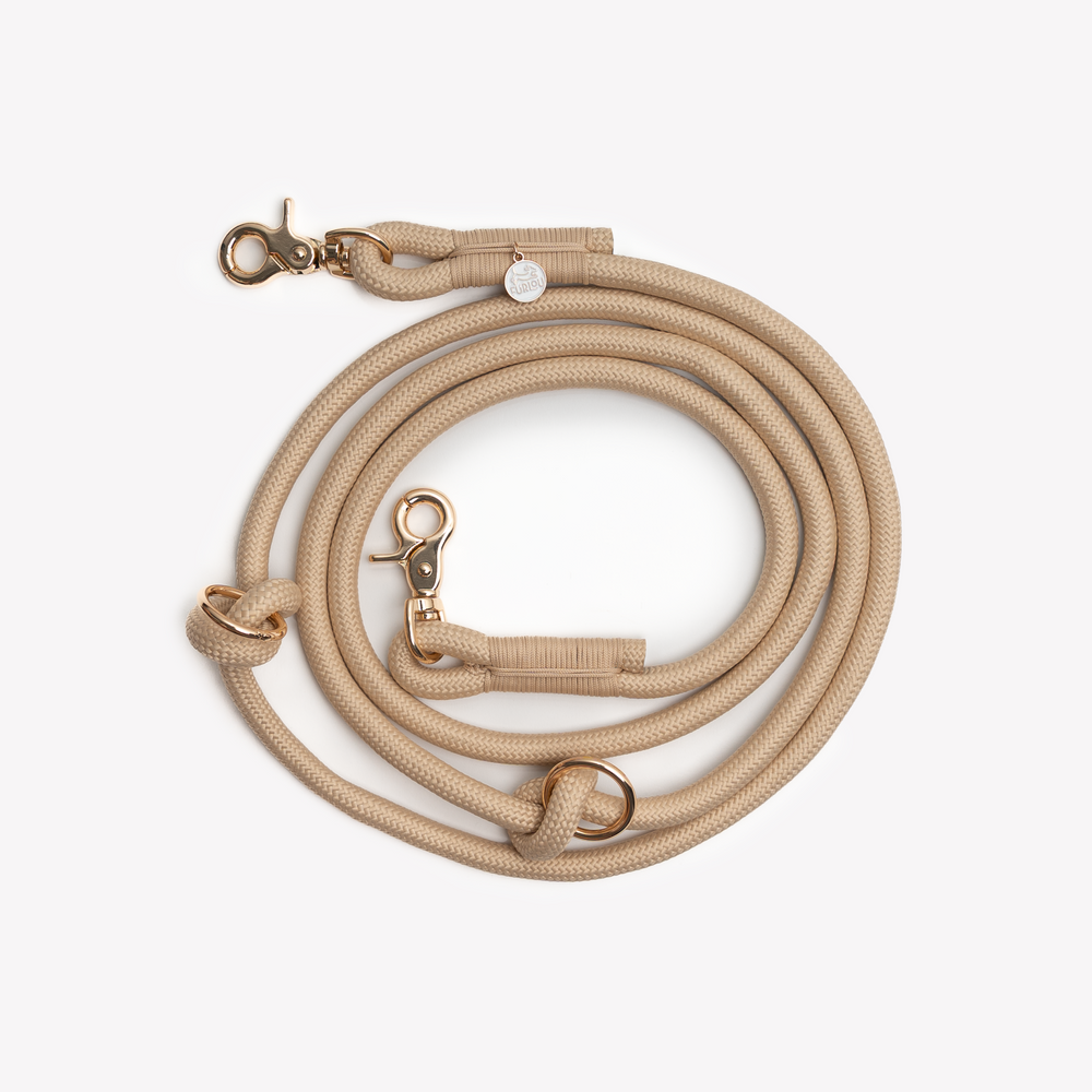adjustable tan dog leash with gold clip

