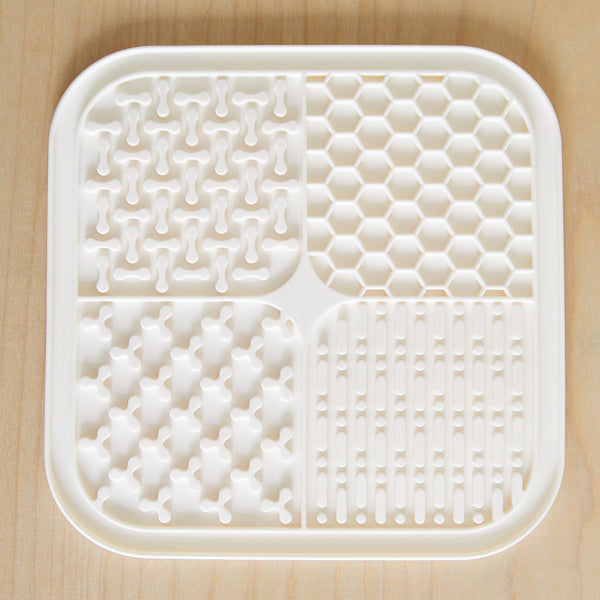 Easy to clean dog lick mat shown in sink

